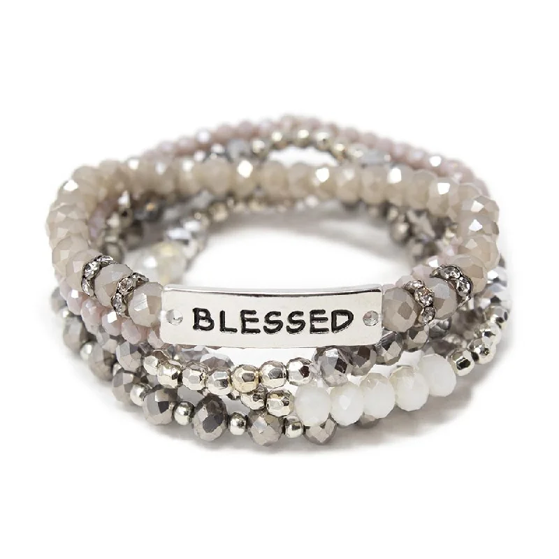 Set of Five Black Stretch Bracelets and a Rhodium Plated "Blessed"